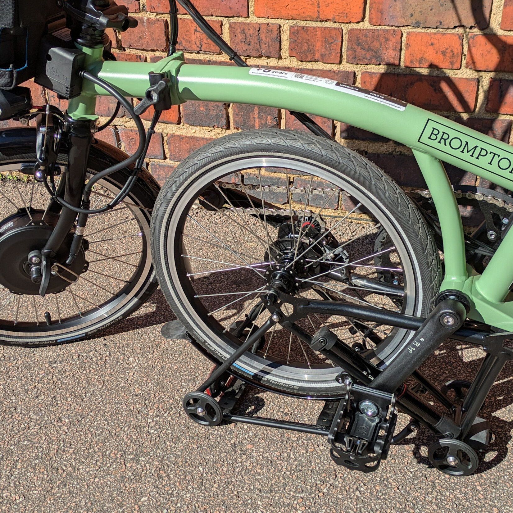 Brompton EX-DEMO Electric C Line 4 Speed Mid Folding Bike with Roller Rack - Matcha Green and Black
