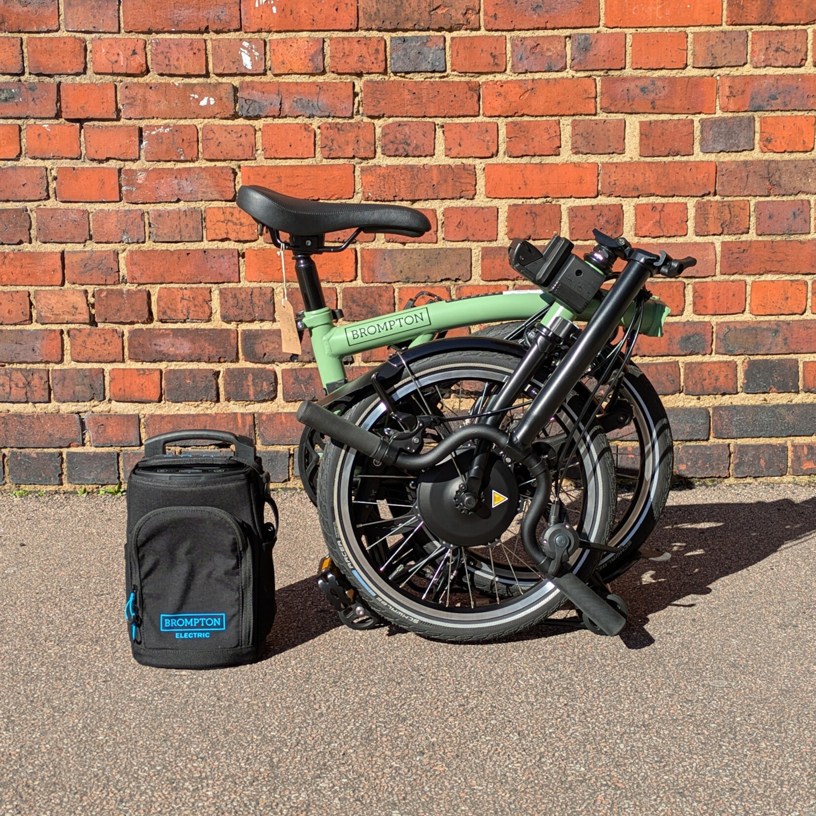 Brompton EX-DEMO Electric C Line 4 Speed Mid Folding Bike with Roller Rack - Matcha Green and Black