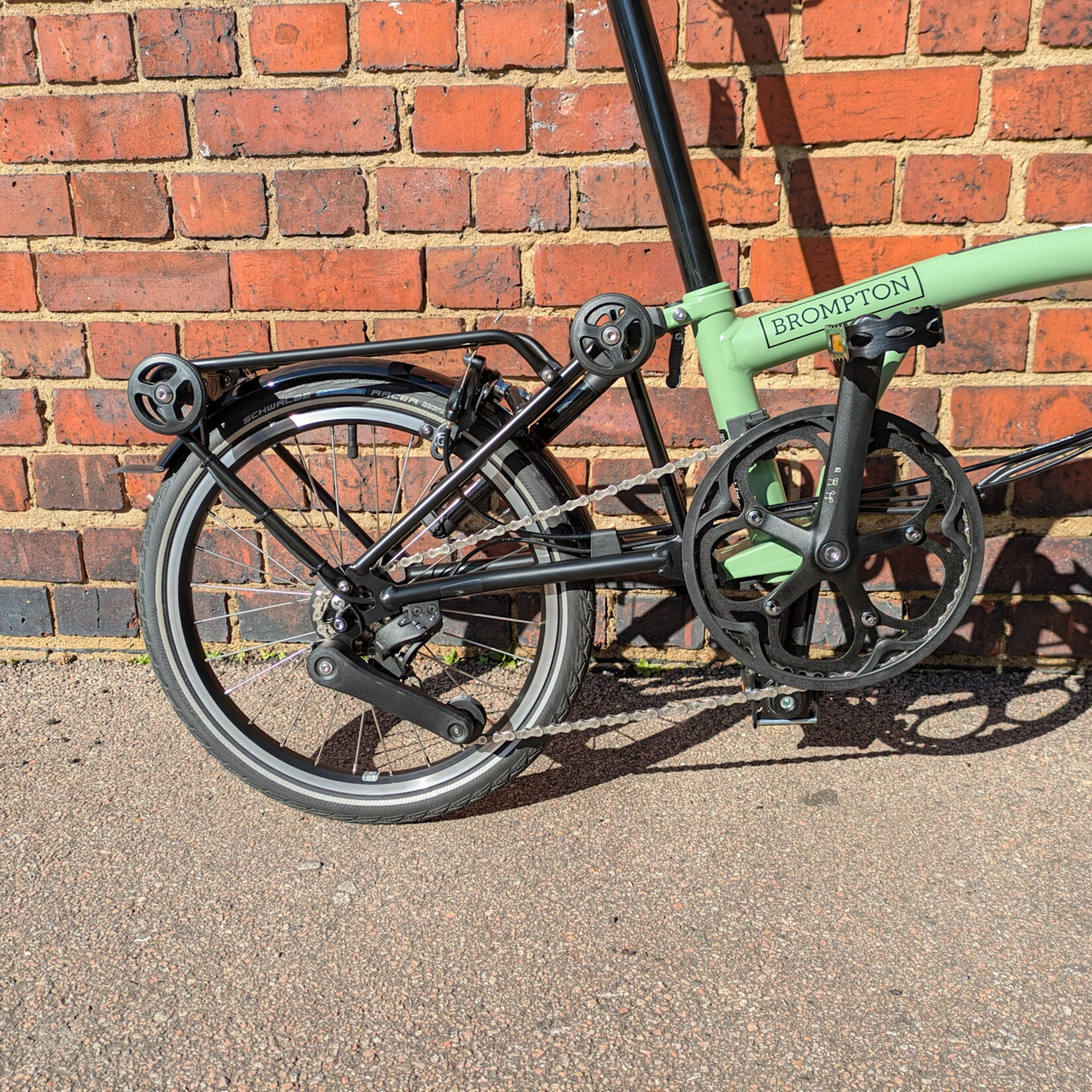 Brompton EX-DEMO Electric C Line 4 Speed Mid Folding Bike with Roller Rack - Matcha Green and Black