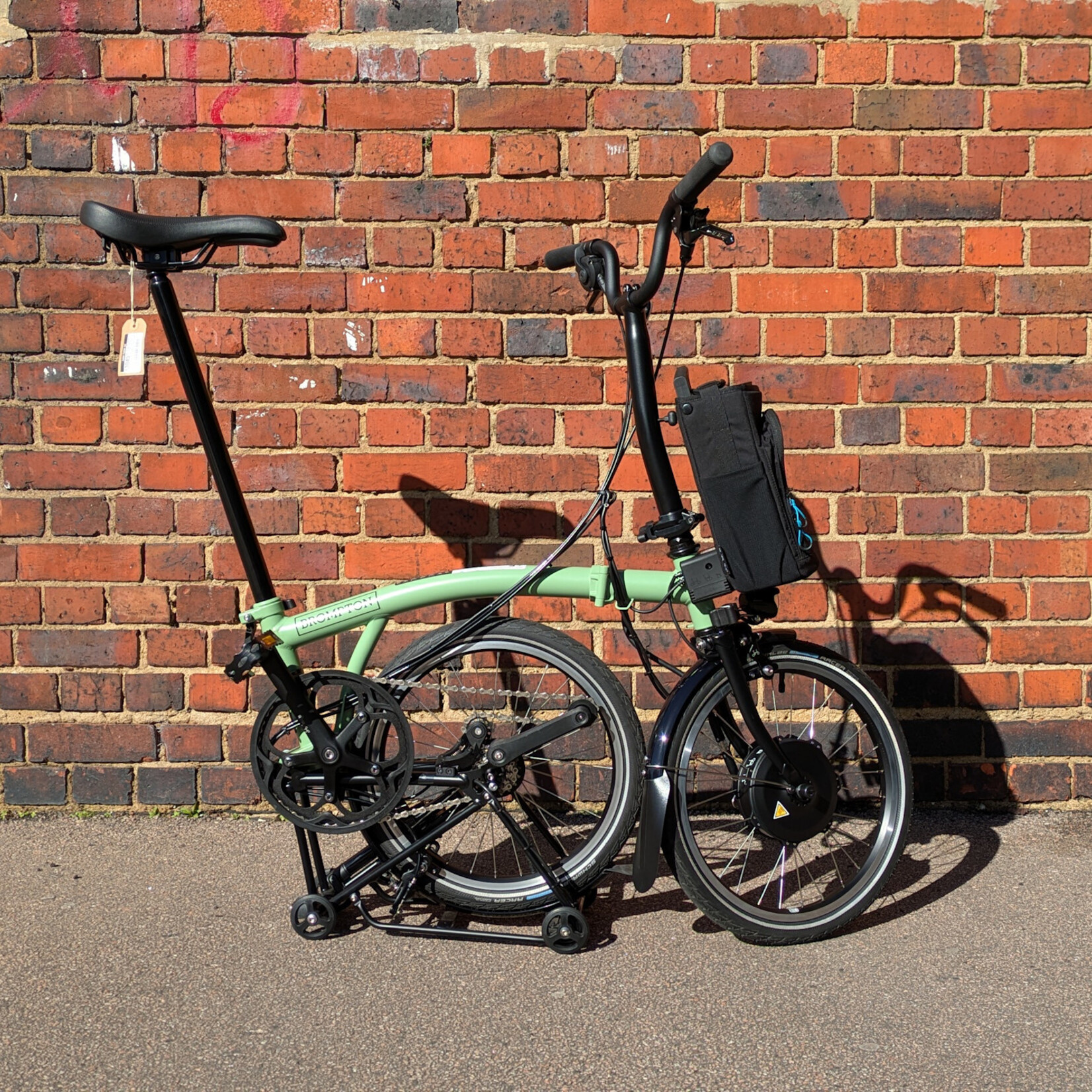 Brompton EX-DEMO Electric C Line 4 Speed Mid Folding Bike with Roller Rack - Matcha Green and Black