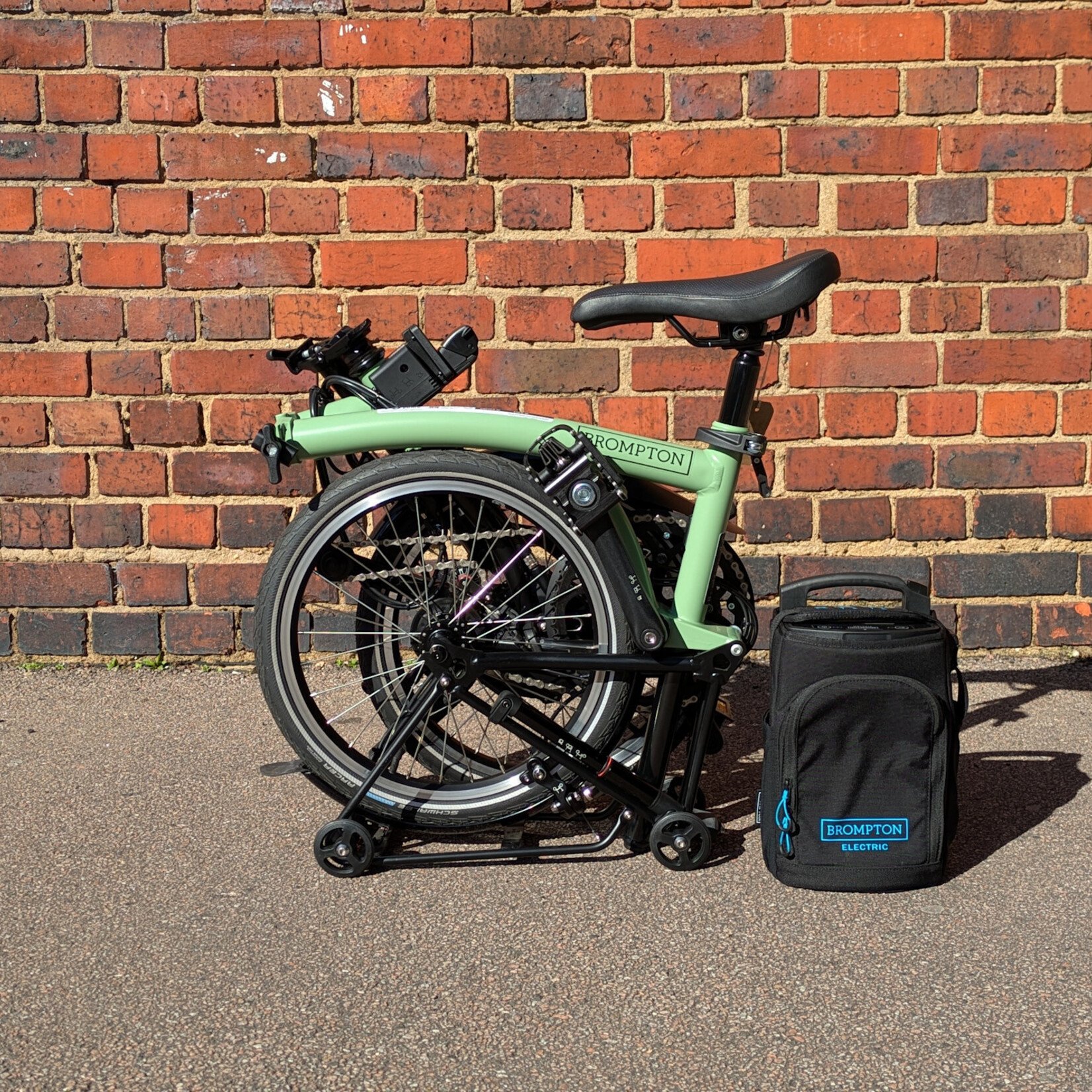 Brompton EX-DEMO Electric C Line 4 Speed Mid Folding Bike with Roller Rack - Matcha Green and Black