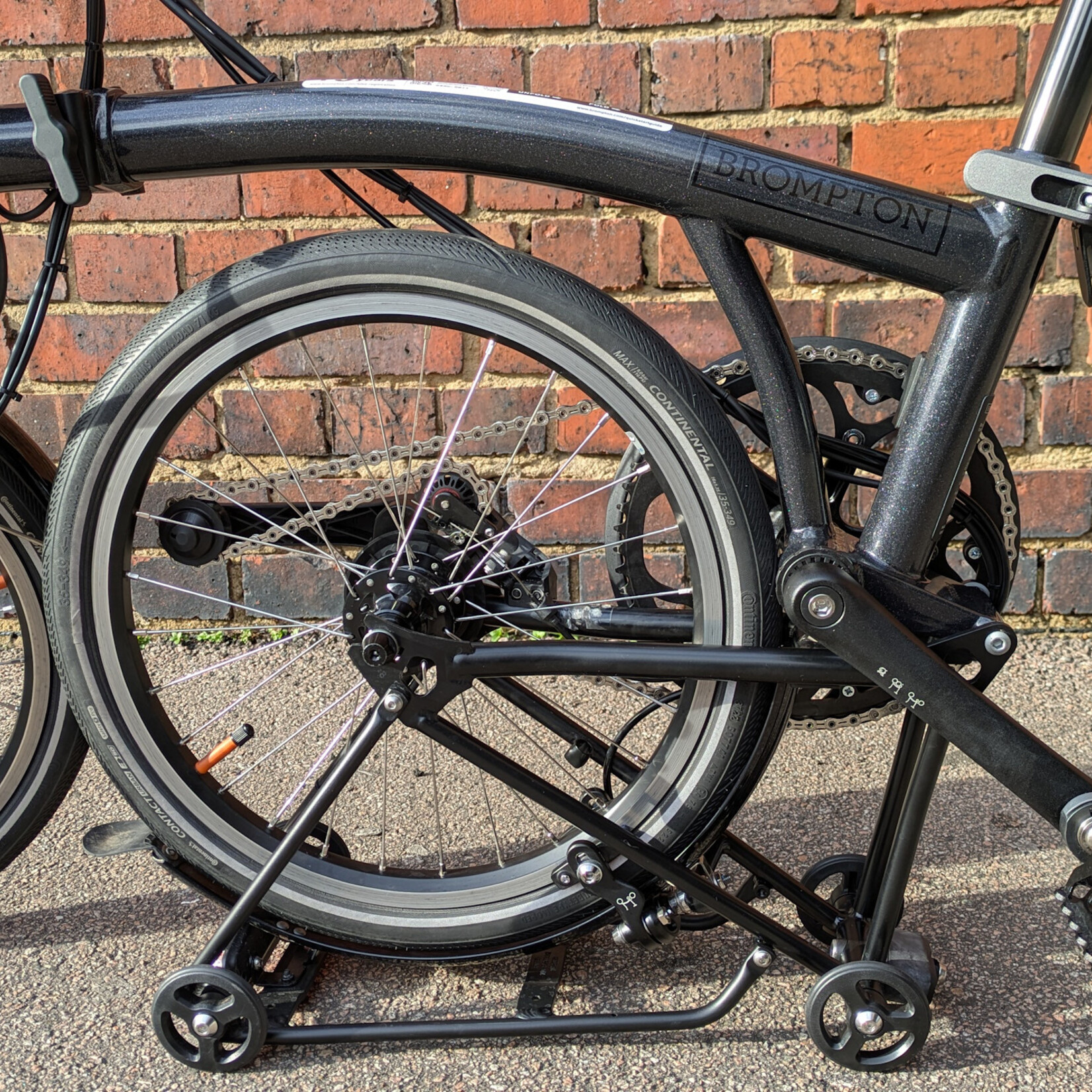 Brompton EX-DEMO Electric P Line 4 Speed High Folding Bike with Roller Rack - Midnight Black Metallic