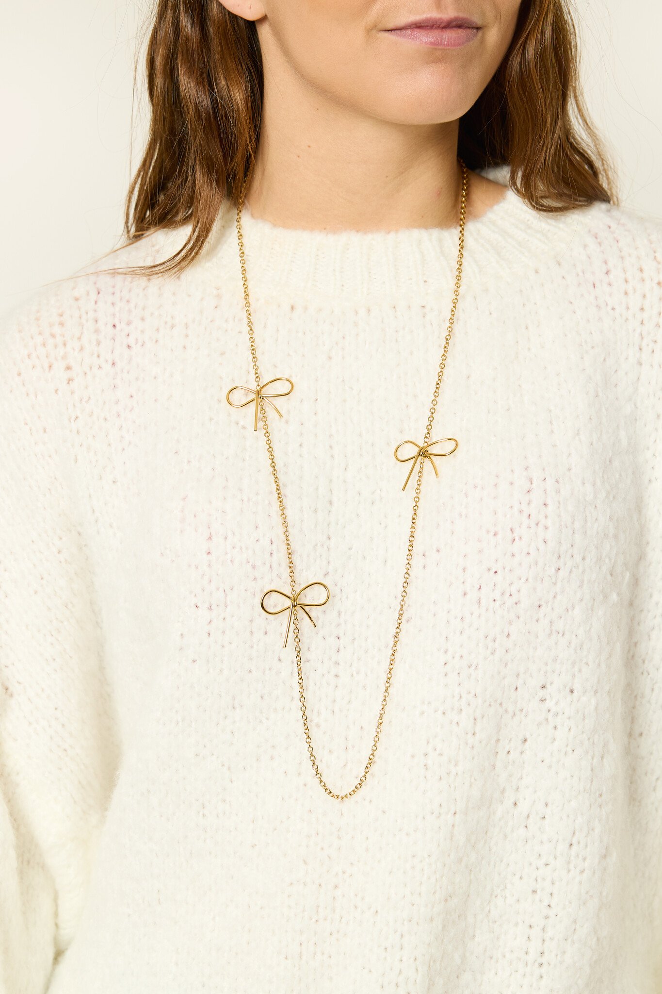 Lange ketting met strikjes | Goud