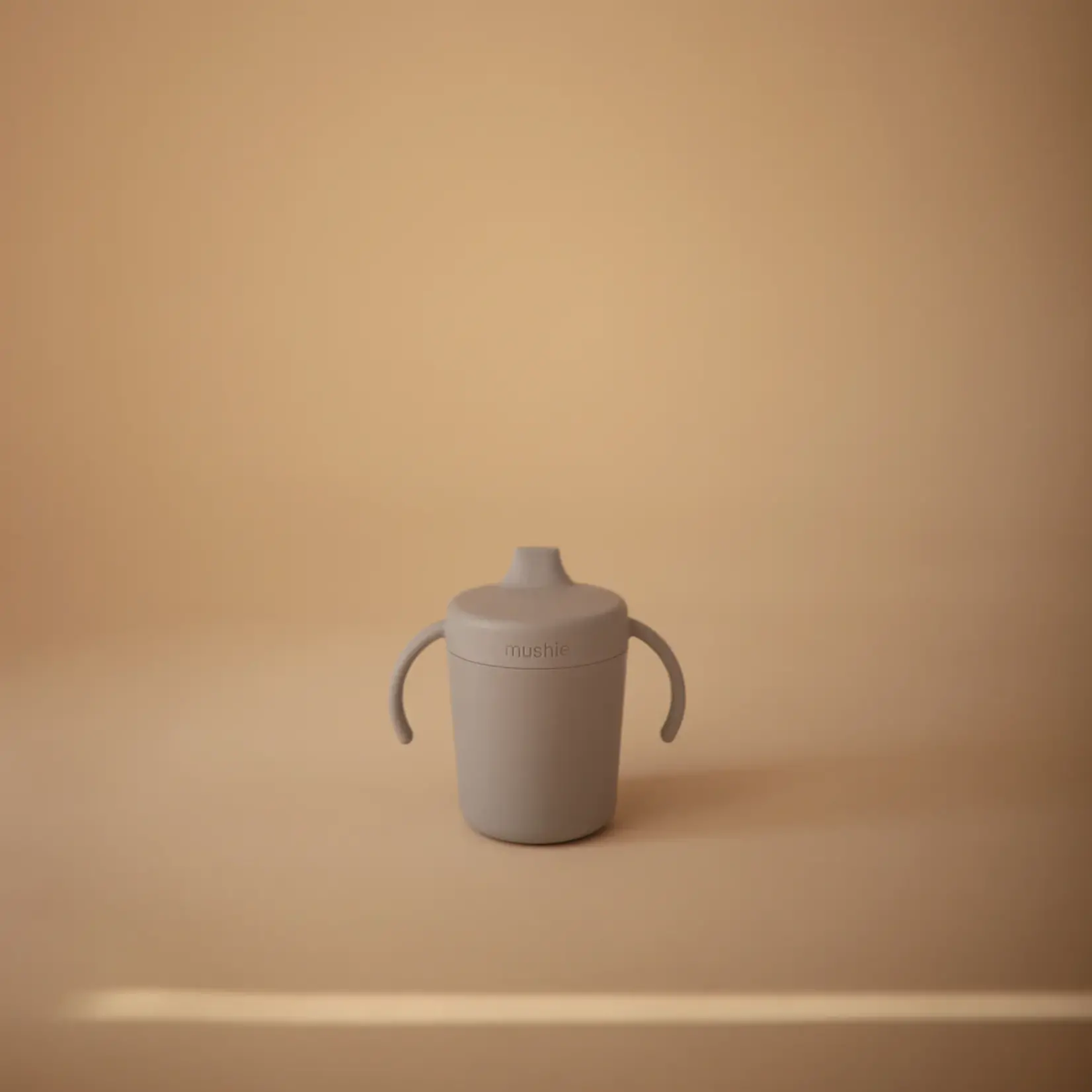 Mushie Training sippy cup with handles