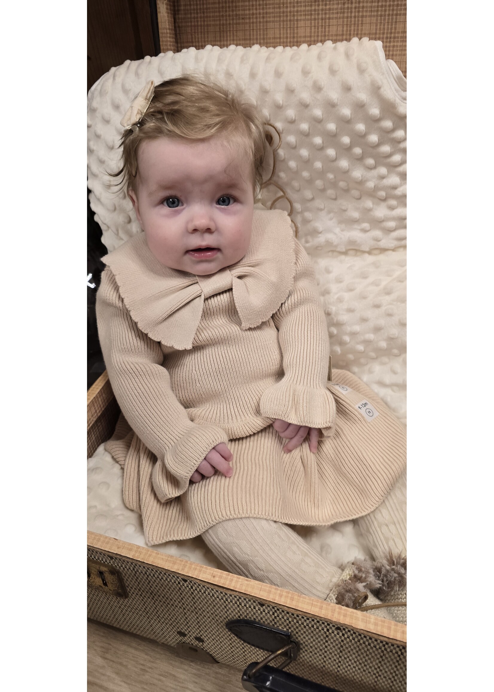 Gebreid jurkje met strik