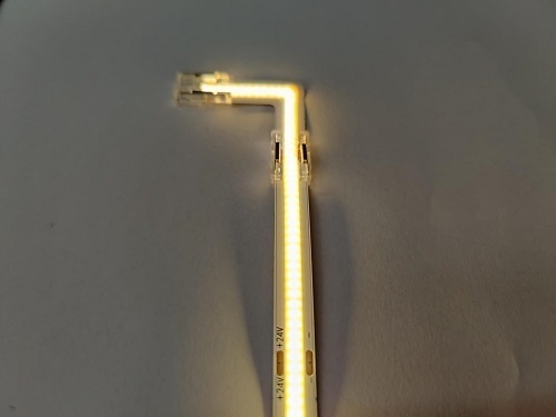 Doorverlichte 24 volt COB LED Strip - 90 graden transparante hoek connector T.B.V. 2700K extra warm witte COB LED Strips  - IP20