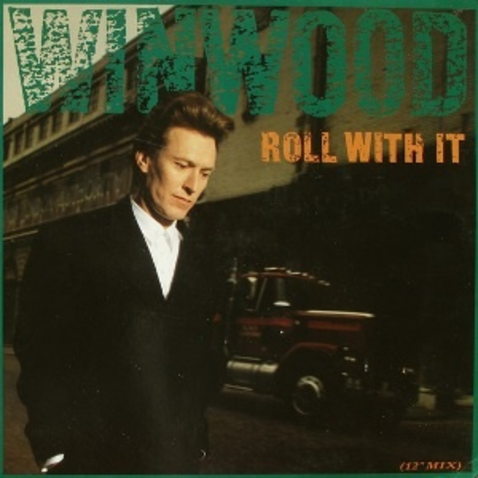 Steve Winwood ‎– Roll With It