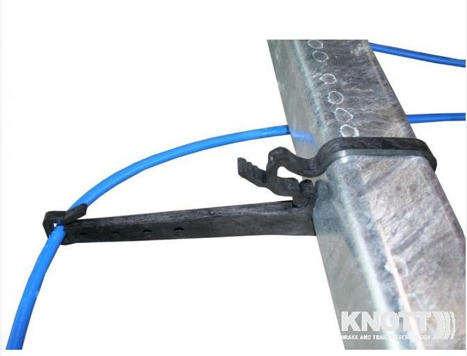 Plastic brake cable holder from Knott to brake cables