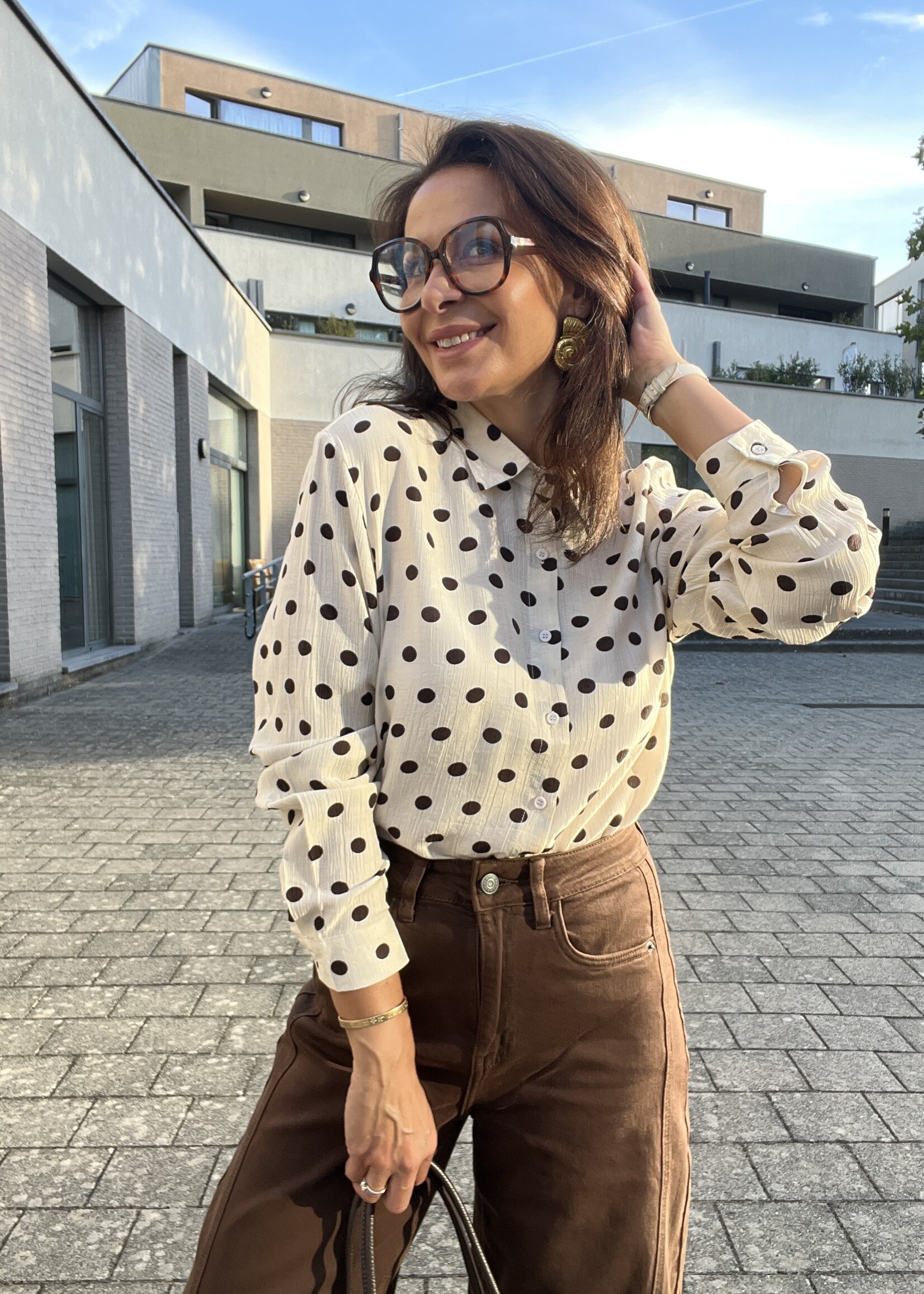 Soepelvallende blouse met stippen