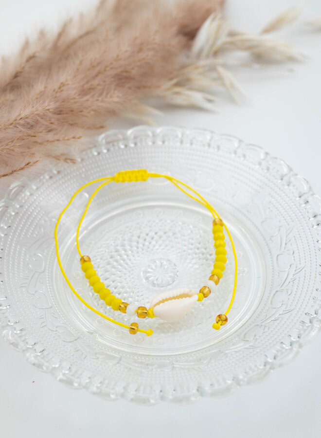 Enkelbandje geel met schelp