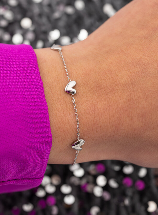 Subtiele armband drie harten
