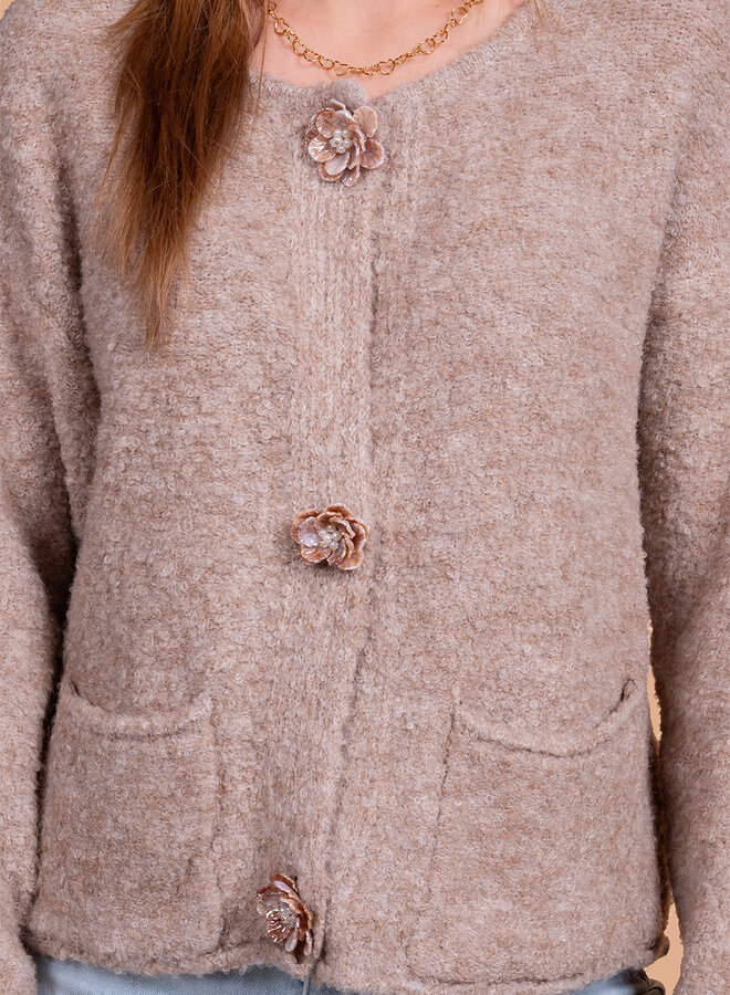 Wollen vest met bloemen knoop