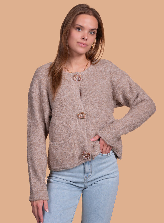 Wollen vest met bloemen knoop