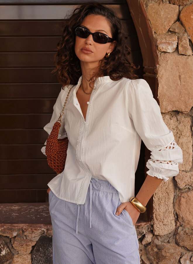 Witte blouse met ruffle boord