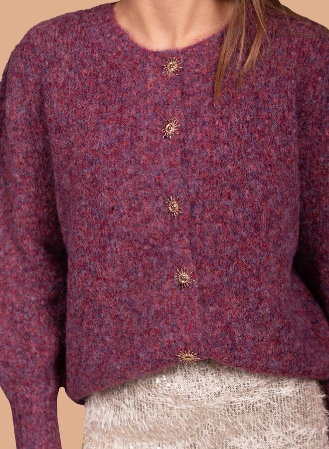 Zacht vest met zon knopen