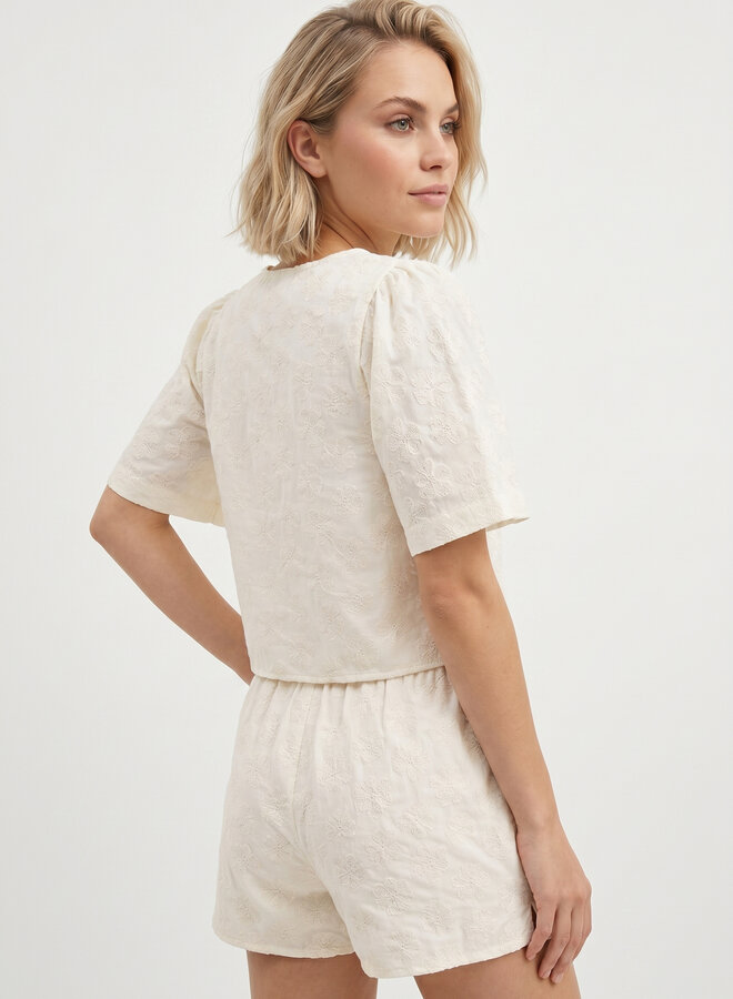 Beige top met bloemen en strikjes