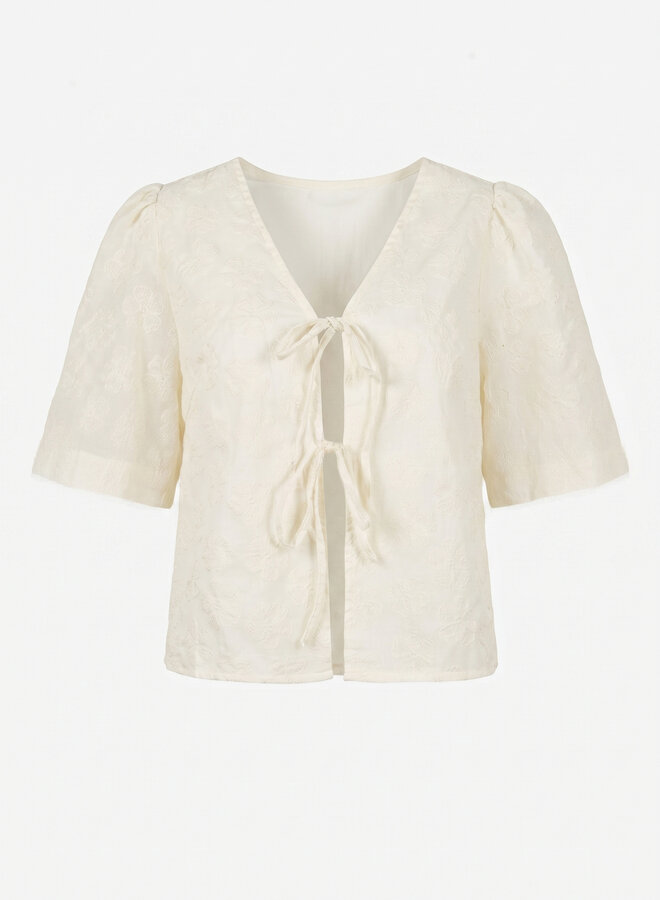 Beige top met bloemen en strikjes