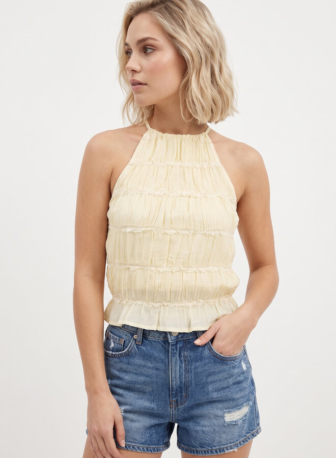 Gele top met plooien