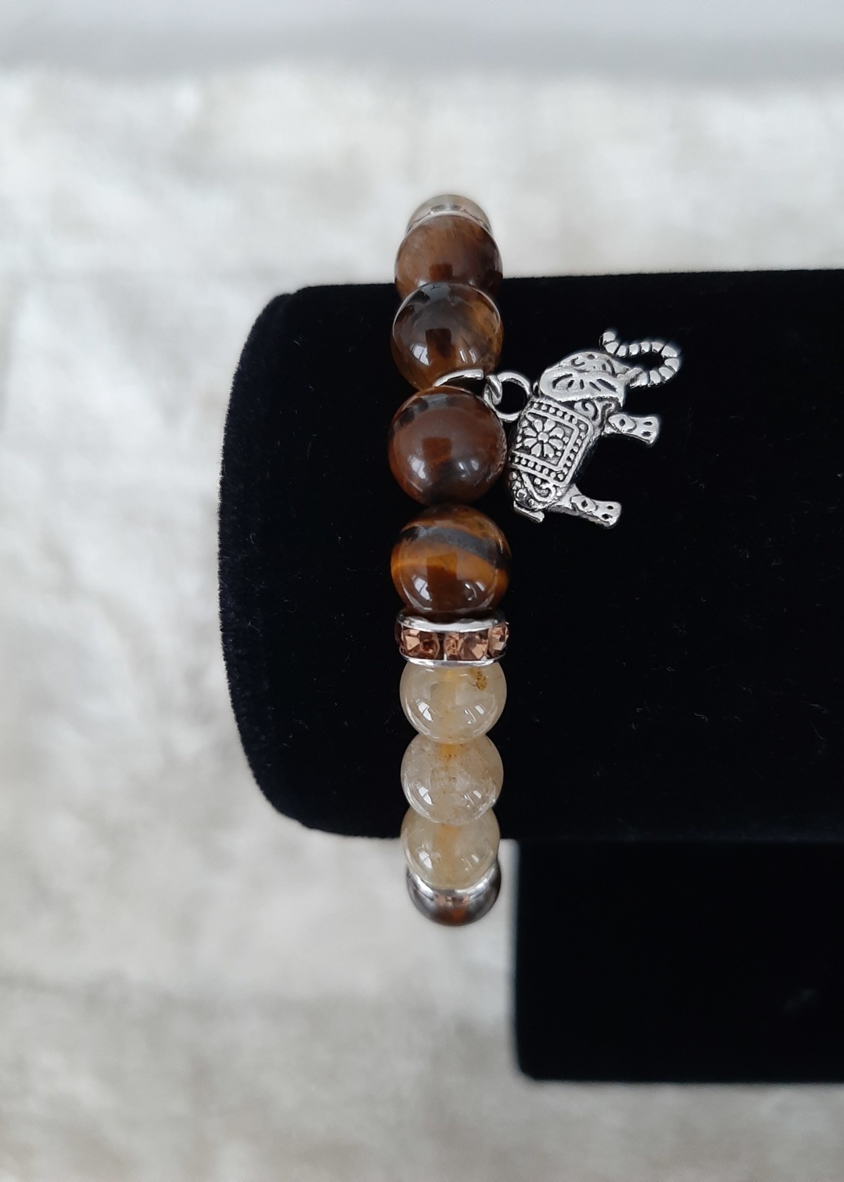 Bracelet Tigereye/Rutile quartz with elephant charm