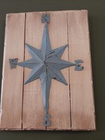 Wooden board with wind rose