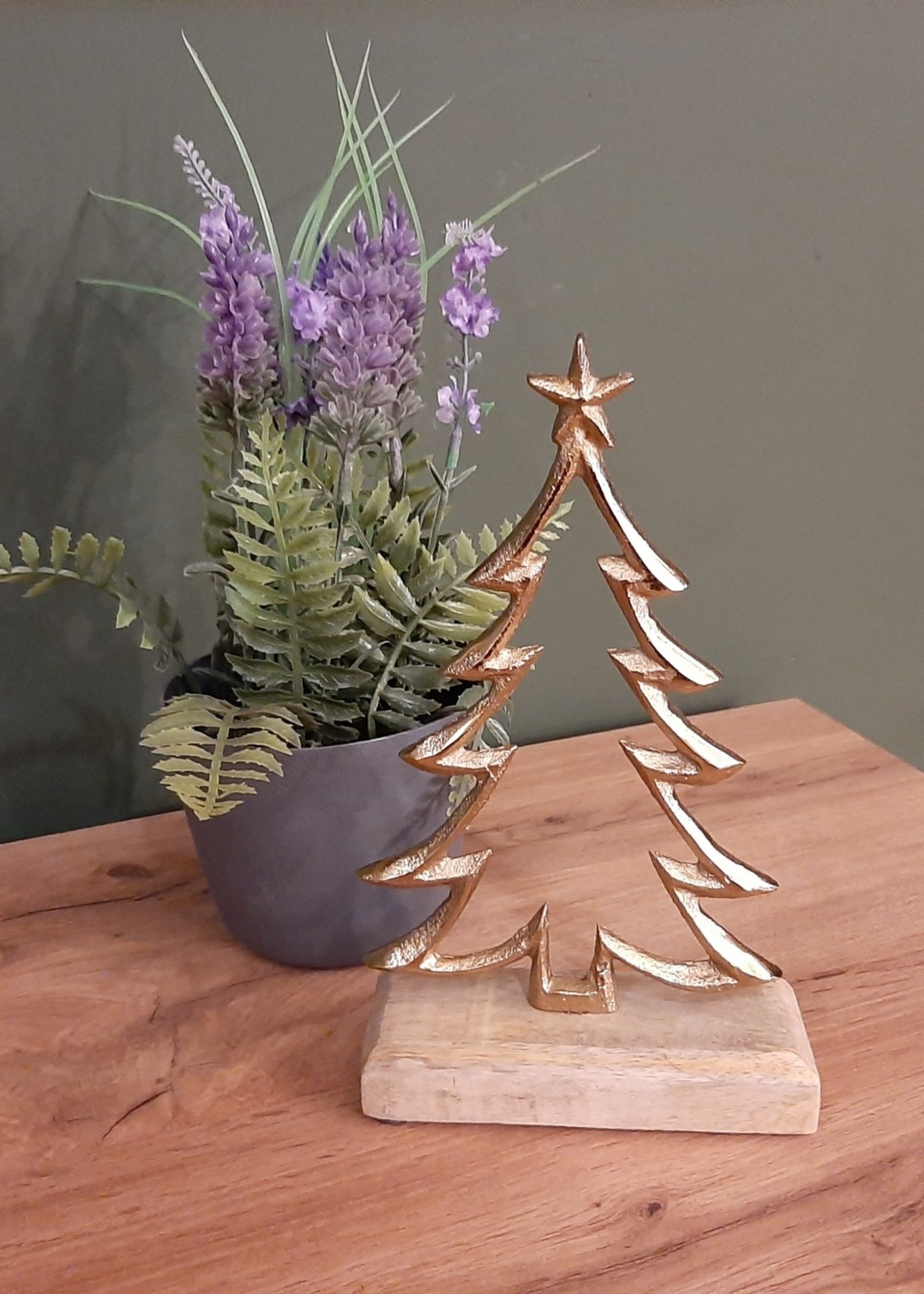 Gold-coloured Christmas tree on a wooden base