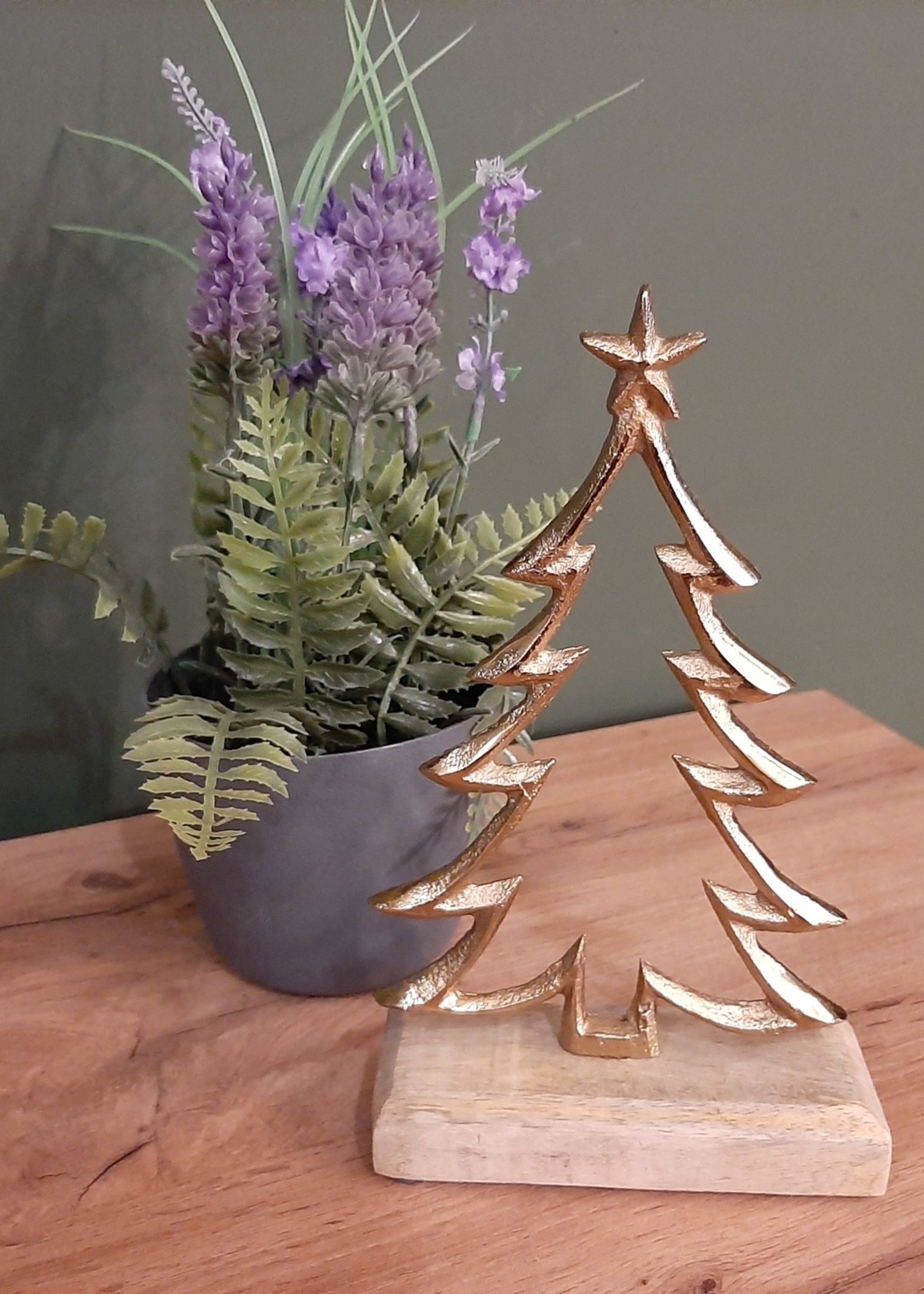 Gold-coloured Christmas tree on a wooden base