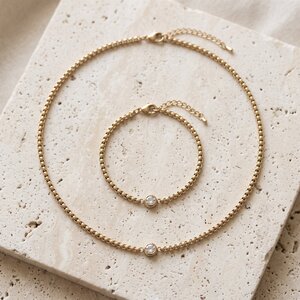 Lundholm Anah – Zirkonia Sieradenset met Ketting en Armband – Goudkleurig Lundholm Anah – Zirkonia Sieradenset met Ketting en Armband – Goudkleurig