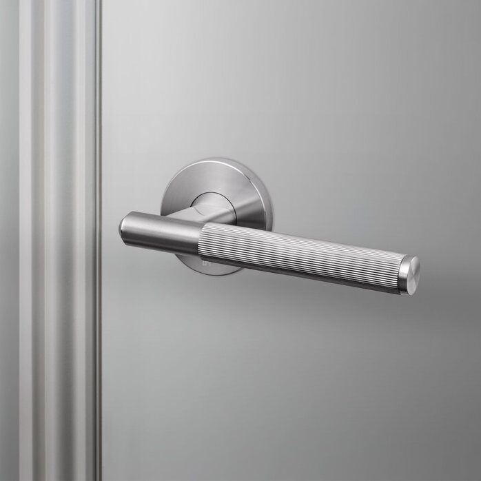 Buster and Punch Door handle in Steel with Linear Pattern - Sprung
