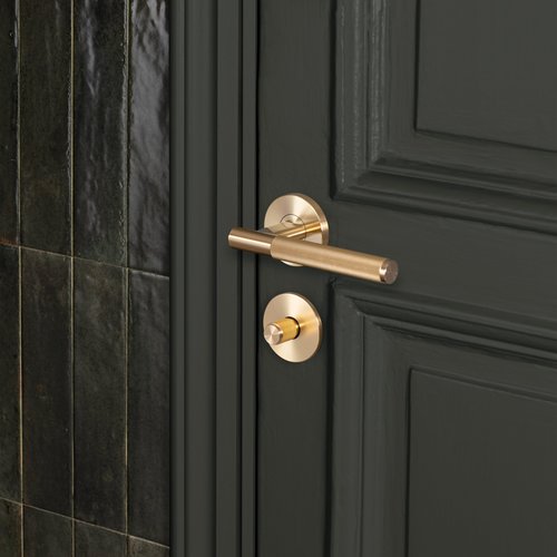 Buster and Punch Door Handle in Gold Brass with Linear Pattern - Sprung