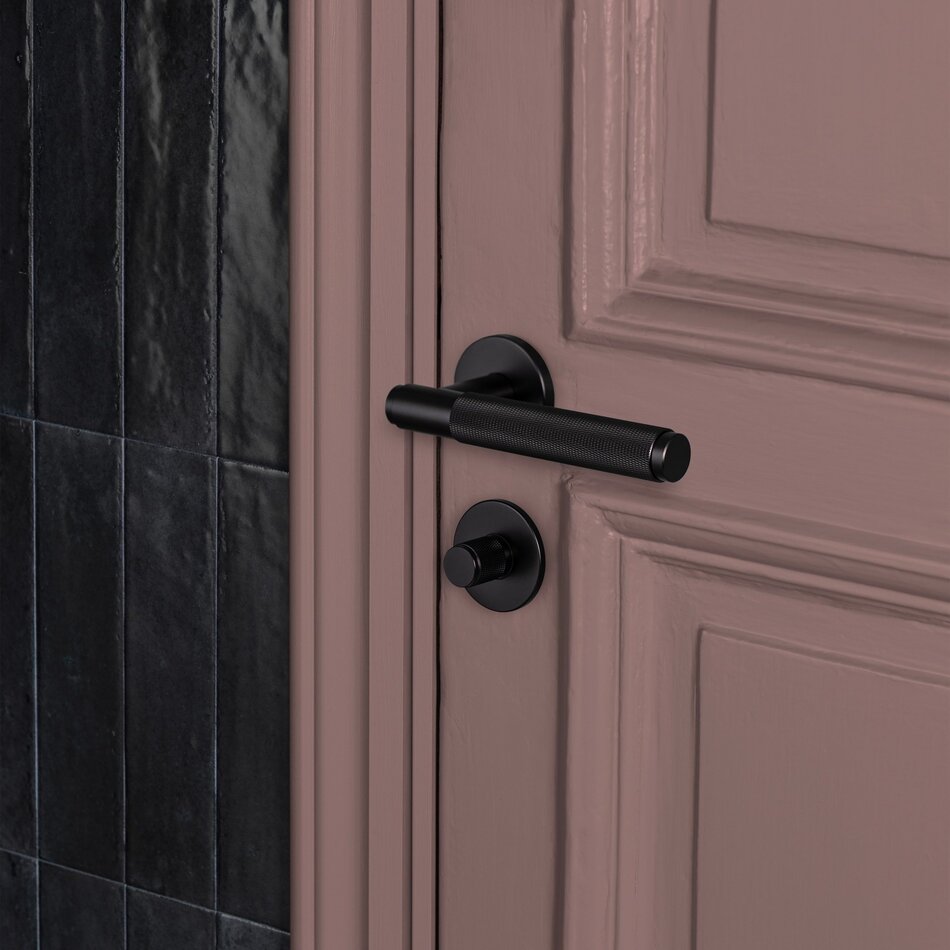 Buster and Punch Door handle in Black with Cross Pattern - Sprung