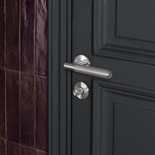 Buster and Punch Door handle in Steel with Cross Pattern - Sprung