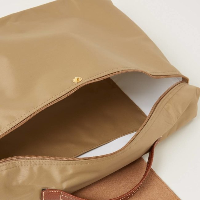 Beige handtas met leren details