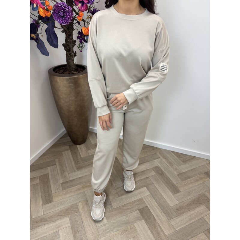 2 delig pak embleem Beige