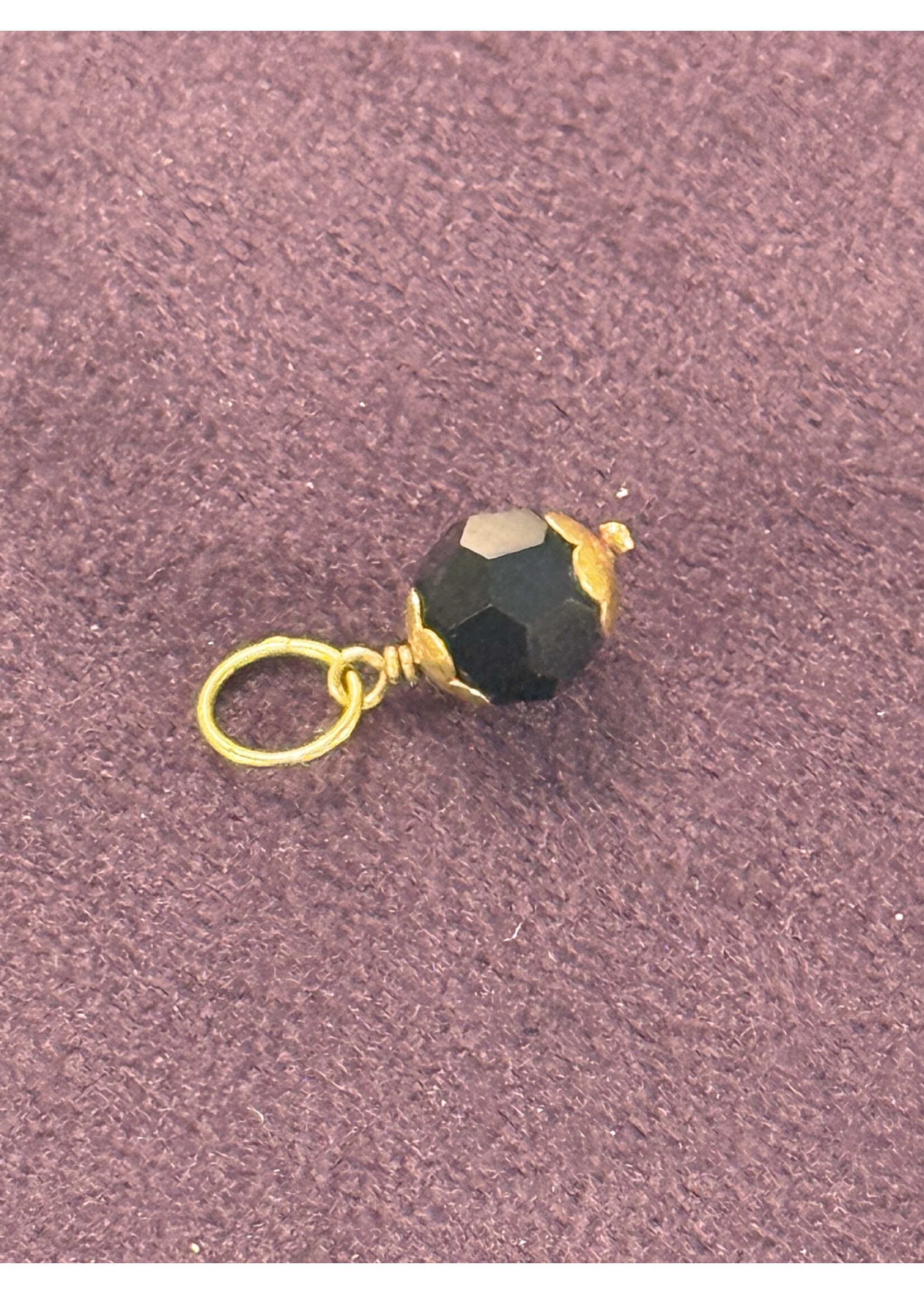 Vintage & Occasion Geelgouden Surinaamse gelukskraal orgi eye zwart