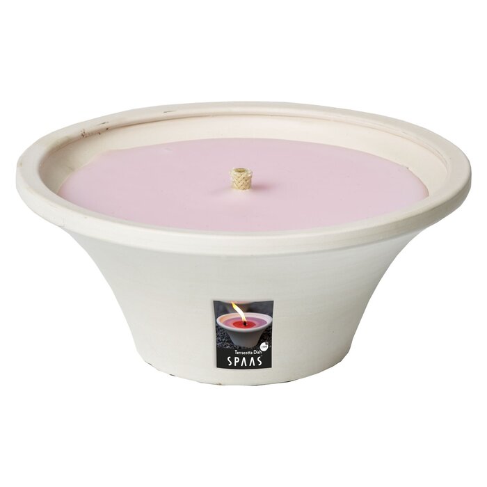 Witte outdoor schaal gevuld met oudroze was