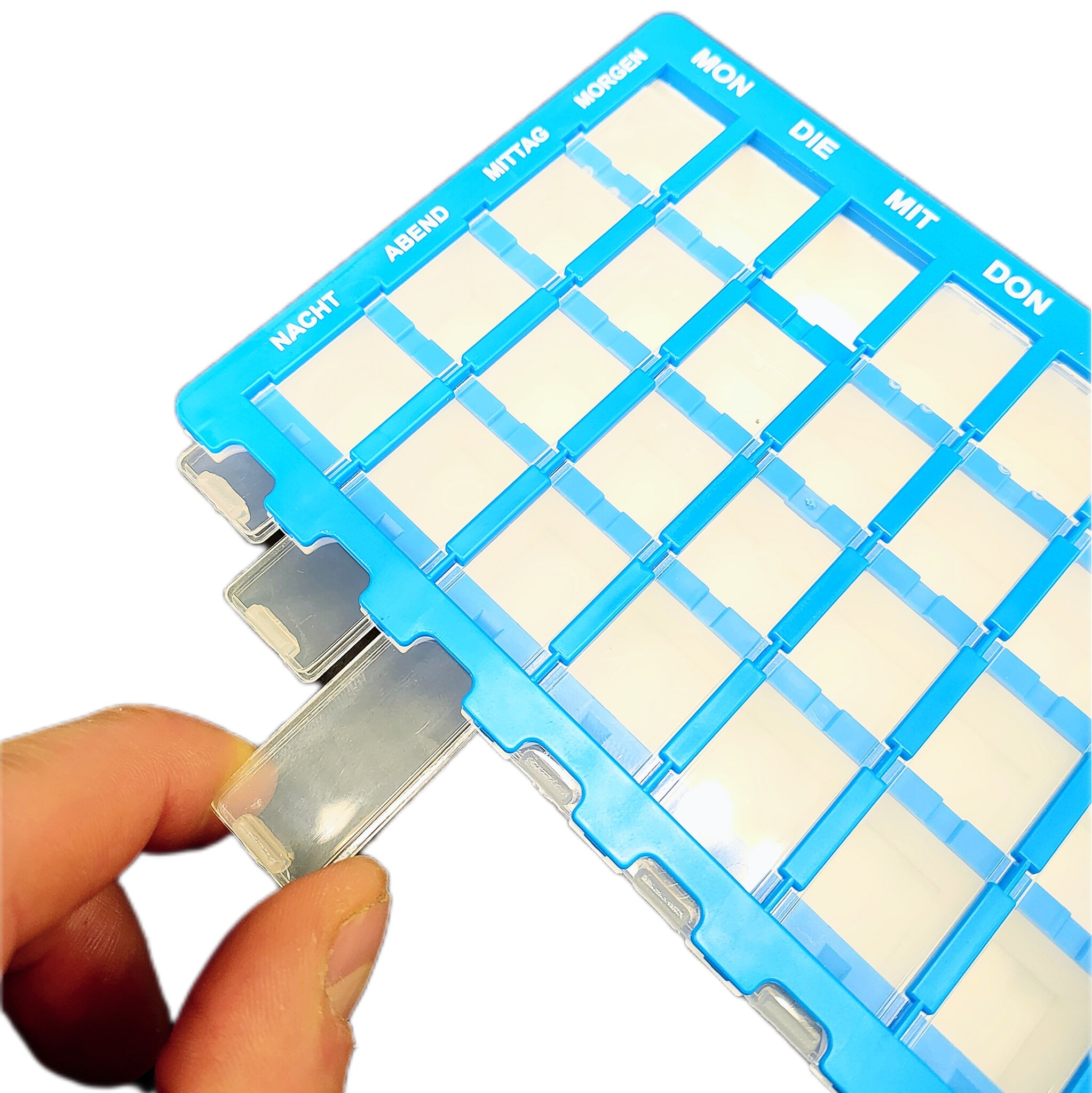 Pillendoos 7 dagen - 4 vakken per dag - Duitstalig - licht blauw, foto 2 van 3