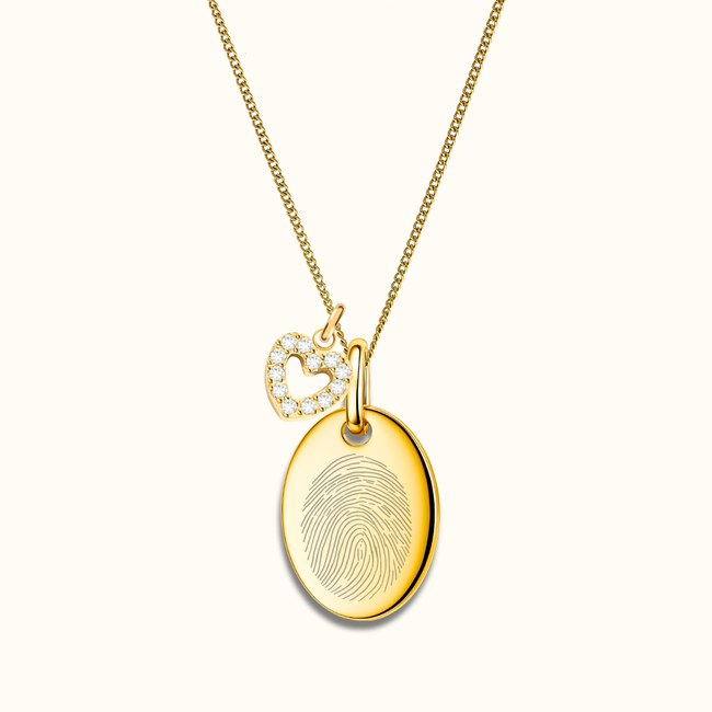 Ovale ketting met vingerafdruk en klein bedeltje hartje