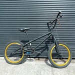 Black BMX with gold wheels