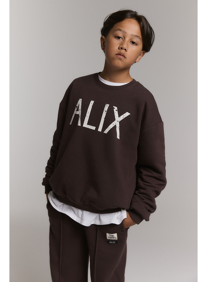 Knitted world tour sweater warm brown