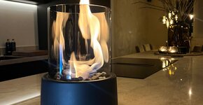 Ontdek de magie van sfeervolle warmte: De Midnight Onyx bio-ethanol tafelhaard van Homerebels.