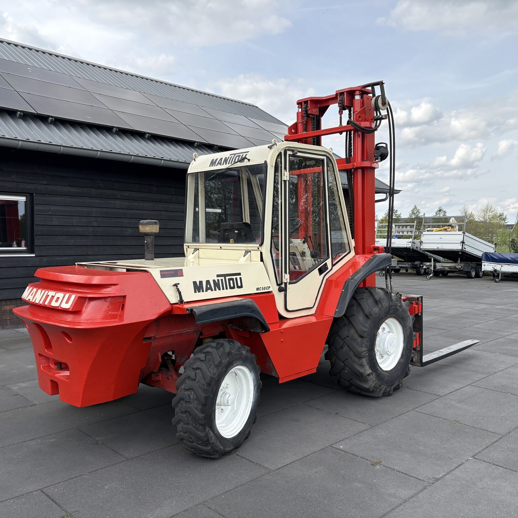 Manitou MC50CM Ruw terrein heftruck met cabine in goede staat