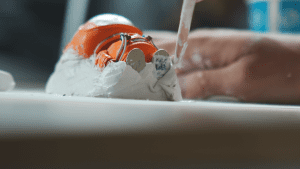 Use clay to make a formable shape out of your figurine