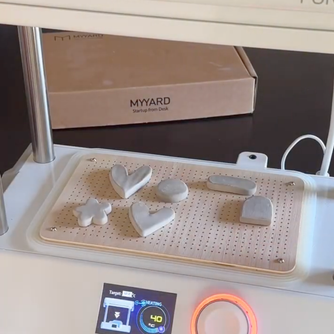 The clay shapes for the magnets on a MY YARD desktop vacuum forming machine
