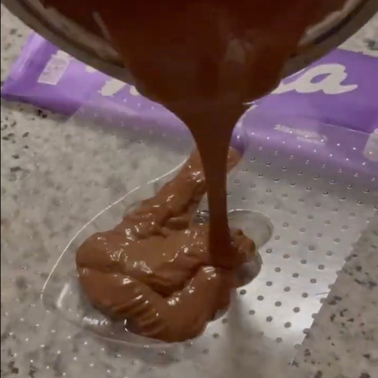 Pouring chocolate into the PET mould