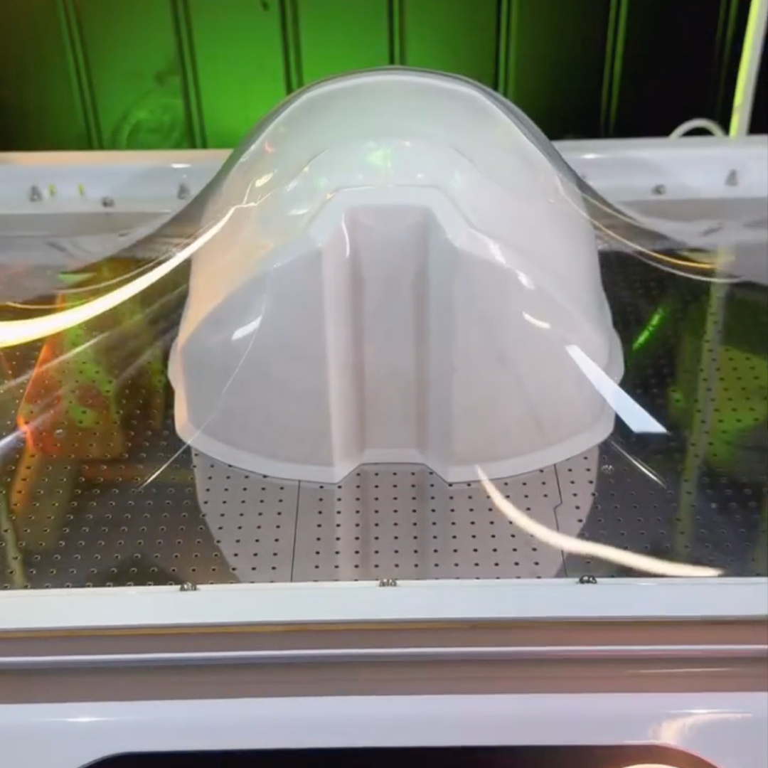 Vacuum forming a PET sheet over the visor