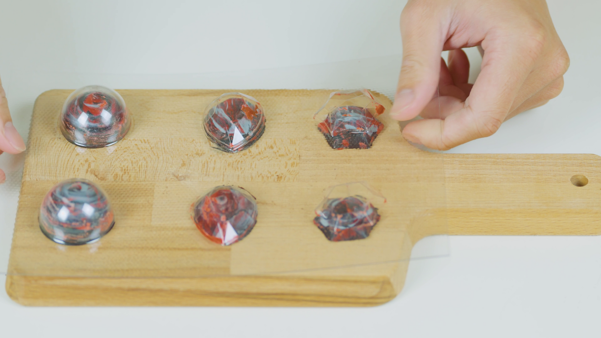 Removing the chocolates from their custom mould