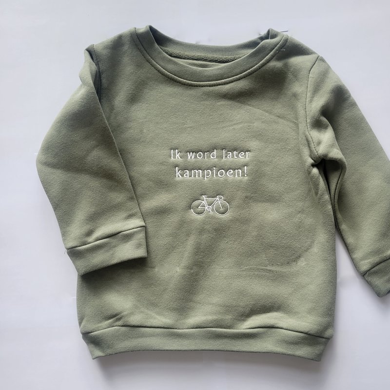 Koerswiel 'Ik word later kampioen' baby/peuter sweater!