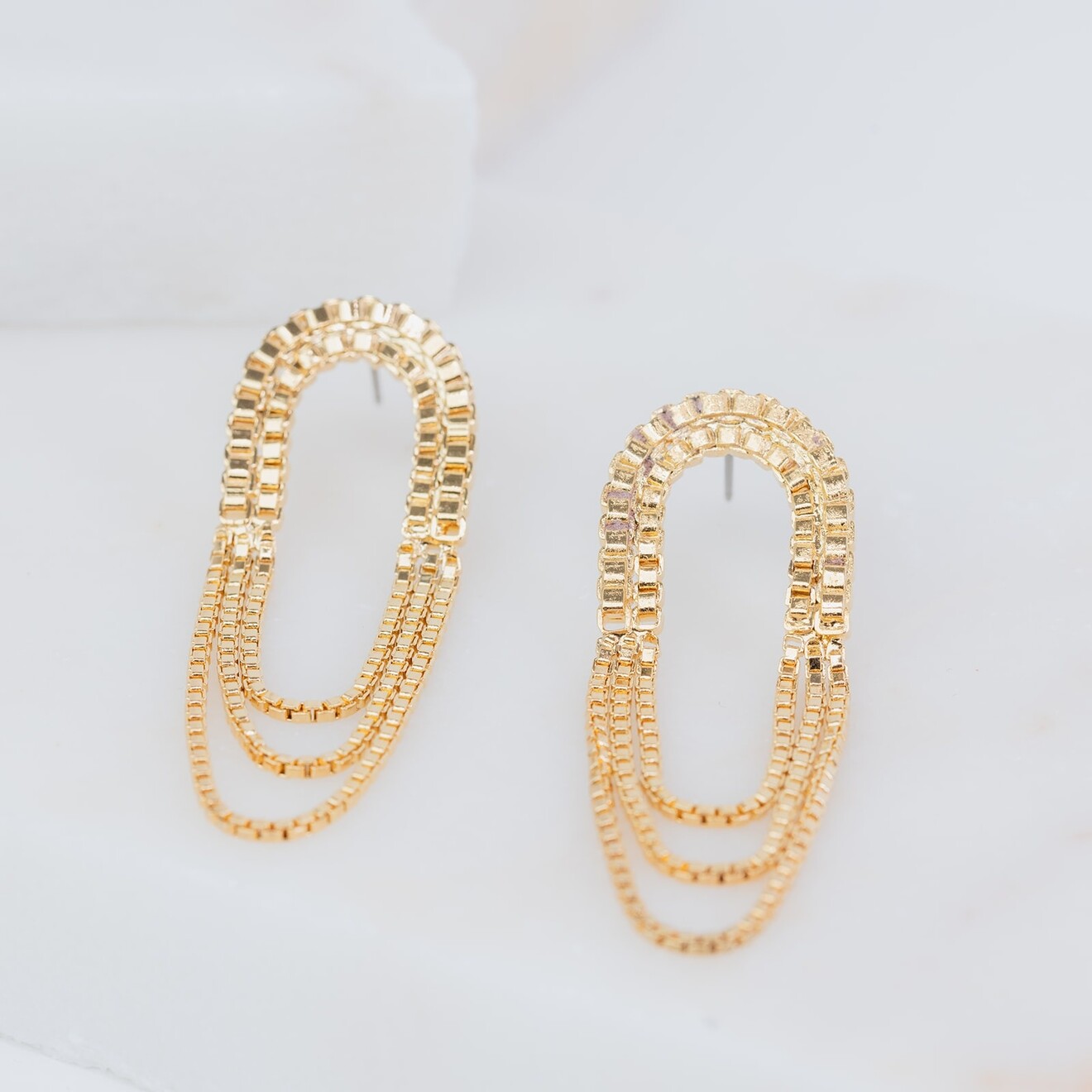 Lumi gouden chain statement oorbellen