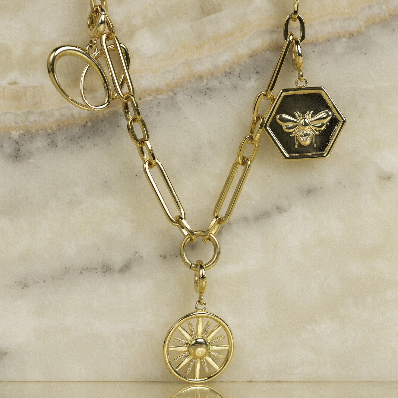 Clover charm voor ketting goud