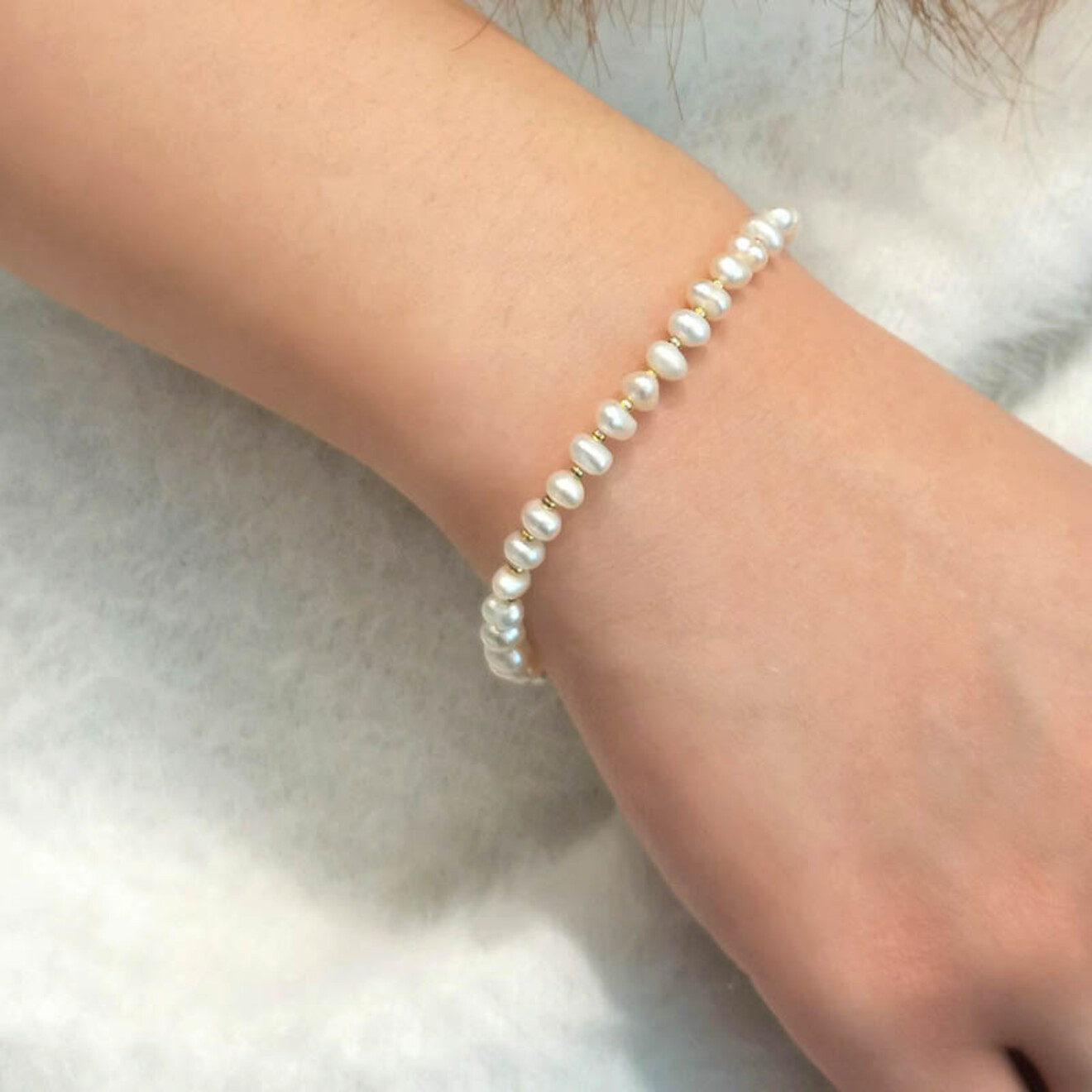 Lore zoetwaterparel armband goud
